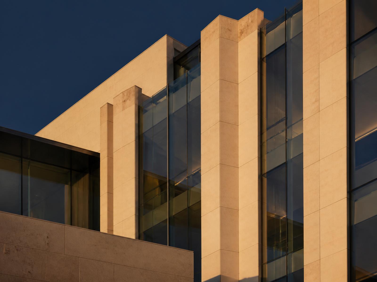 Minimalist modern office building facade at golden hour